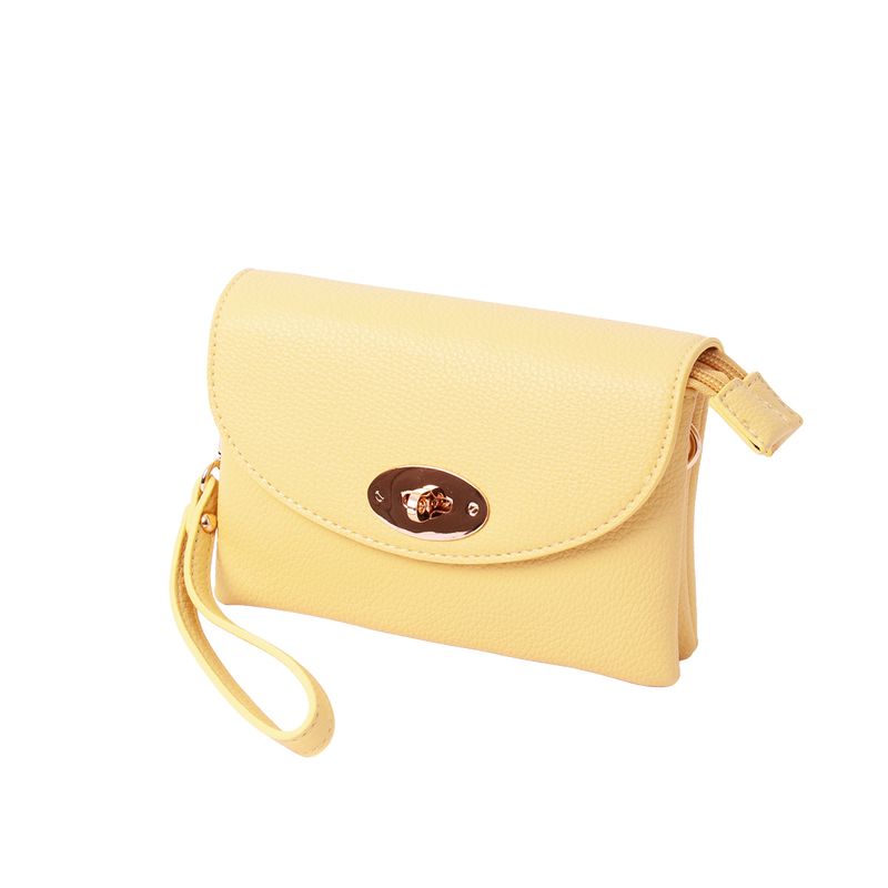 DANIELLE clutch ljus gul i imiterat skinn